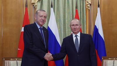 Turkish President Recep Tayyip Erdogan and Russian President Vladimir Putin shake hands before their meeting at the Russian Black Sea resort of Sochi. AP
