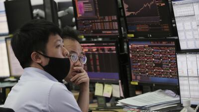 Currency traders watch monitors at a foreign exchange dealing room at KEB Hana Bank headquarters in Seoul, South Korea. High levels of corporate debt are an area of concern as the global economy faces disruption as a result of Covid-19, according to UNCTAD. AP Photo