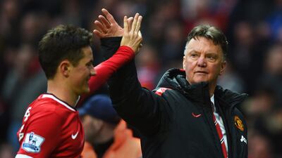 Ander Herrera and manager Louis van Gaal celebrate after Manchester United's 4-2 win over Manchester City at Old Trafford on Sunday. Michael Regan / Getty Images
