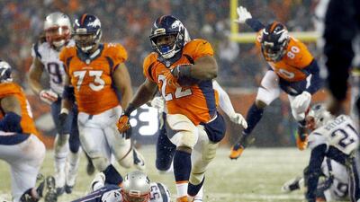 Denver Broncos running back CJ Anderson (22) breaks free for the game-winning touchdown against the New England Patriots during overtime of an NFL football game, Sunday, Nov. 29, 2015, in Denver. The Broncos defeated the Patriots 30-24. (AP Photo/Jack Dempsey)