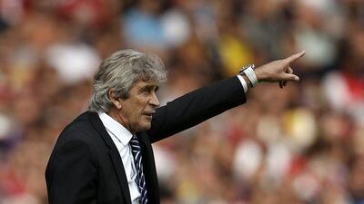 Manuel Pellegrini's Manchester City side are fifth in the Premier League table after four matches, with two wins, a draw and a loss. Adrian Dennis / AFP / September 13, 2014