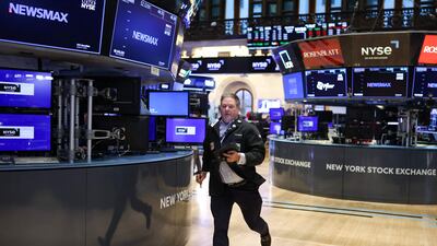 A trader runs across the floor of the New York Stock Exchange at the opening bell as stocks sank in early trading, joining a global equity sell-off after US President Donald Trump's latest tariff announcement. AFP