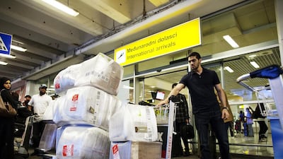 Saif Al Saeed, a graduate manager at Etihad’s corporate strategy department, arrives with aid packages at the airport.