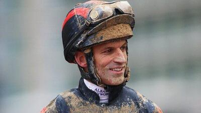 Patrick Dobbs celebrates after riding Second Summer to victory in the Godolphin Mile. Francois Nel / Getty Images