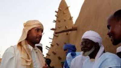 Saif al Islam, left, the son of the Libyan leader, Muammar Qadafi, tours the Grand Mosque in Timbuktu, Mali.