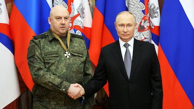 Gen Sergey Surovikin pictured with Russian President Vladimir Putin in 2022. The general has not been seen since Sunday. Reuters