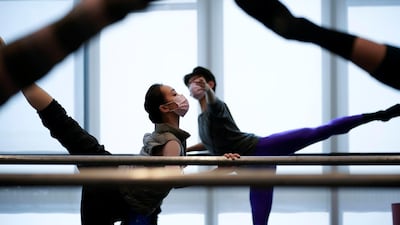 Shanghai Ballet dancers wearing masks practise in a dance studio in Shanghai. Reuters
