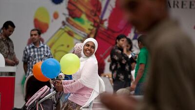 Families enjoying the Eid Al Fitr holiday in Marina Mall, Abu Dhabi. Silvia Razgova / The National