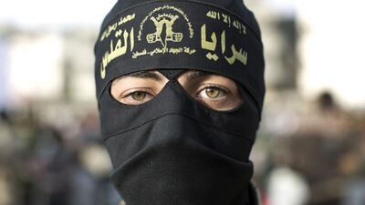 A militant belonging to the Islamic Jihad Movement takes part in a rally to commemorate Prisoners’ Day and to demand the release of Palestinian prisoners, in the Al-Nuseirat refugee camp, in central Gaza Strip. Mahmud Hams / AFP