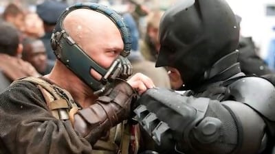 Tom Hardy as Bane and Christian Bale as Batman. Courtesy Warner Bros