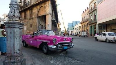 Brightly coloured 1950s American cars still cruise the streets of Old Havana: “Those Chevrolets and Fords are still there, burbling like big beasts in dimly lit roads. Lopsided and creaky, they drive in a time warp.”