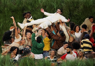 Bad Bunny rarely addressed the crowd directly. Instead, the messages were carried through song choice and imagery. Reuters