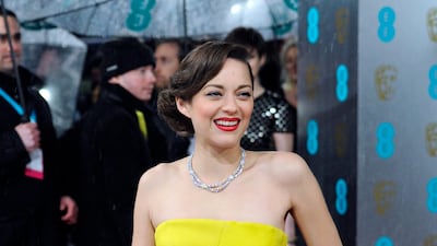 Marion Cotillard, wearing Dior, arrives at the British Academy Film Awards on February 10, 2013. EPA