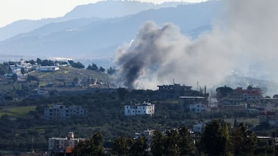Smoke rises from the Lebanese village of Burj Al Muluk. Israeli forces are to withdraw from southern Lebanon under the terms of a truce deal with Hezbollah. AFP
