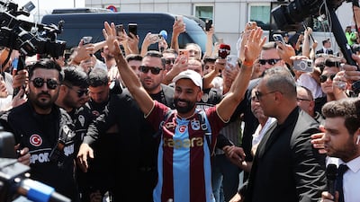 Mohamed Salah waves at fans as he arrives in Turkey to sign with Trabzonspor. Reuters