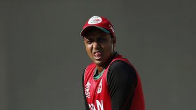 Oman's Sultan Ahmed takes a break during a practice session for ICC World Twenty20 2016 cricket tournament in Dharmsala, India, Tuesday, March 8, 2016. (AP Photo /Tsering Topgyal)