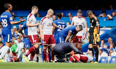 Chelsea's Gary Cahill looks at Burnley's Robbie Brady on the ground after getting a red card. Kirsty Wigglesworth / AP Photo