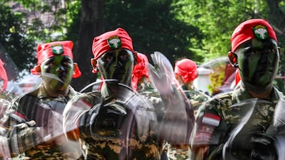 Cadets of the Komponen Cadangan (Komcad), the Reserve Component of the Indonesian National Armed Forces (TNI), take part in a graduation ceremony in Banda Aceh after three months of military basic training. AFP