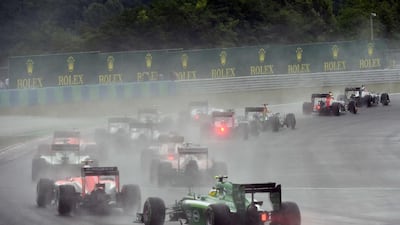 Drives race after the start of the Hungarian Formula One Grand Prix at the Hungaroring circuit in Budapest on July 27, 2014. AFP PHOTO / DIMITAR DILKOFF