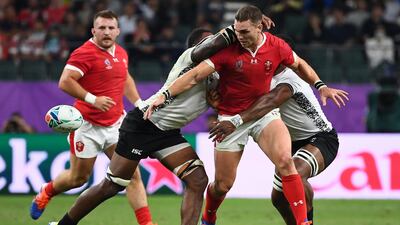 Wales' wing George North (2nd R) is tackled during the Japan 2019 Rugby World Cup Pool D match between Wales and Fiji at the Oita Stadium in Oita. AFP