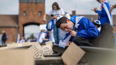 Commemorative plaques are placed on a railtrack leading to Auschwitz-Birkenau death camp in Birkenau, Poland, during the annual march to honour victims of the Holocaust. AFP