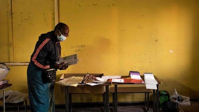 An electoral officer counts ballot papers at a polling station in Lusaka.
