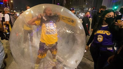 Los Angeles Lakers fans celebrate their team winning the 2020 NBA Championship against the Miami Heat, during the outbreak of Coronavirus disease in Los Angeles, California, U.S. REUTERS