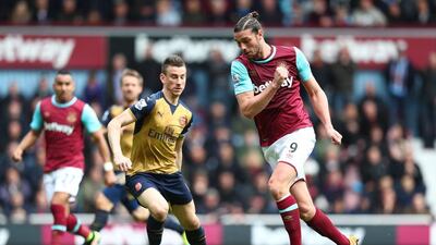 Andy Carroll, right, of West Ham United and Laurent Koscielny of Arsenal compete for the ball during their Premier League match at the Boleyn Ground on April 9, 2016 in London, England. Julian Finney/Getty Images