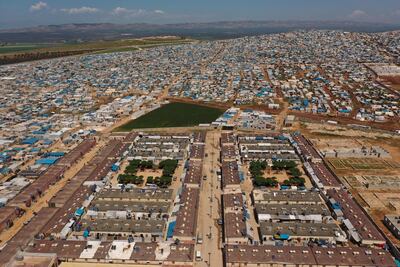 This photo taken in April shows a large refugee camp on the Syrian side of the border with Turkey, near the town of Atma, in Idlib province. AP Photo
