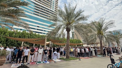 Worshippers gather for Friday prayers at Al Qasba mosque in Sharjah. Ahmed Ramzan / The National