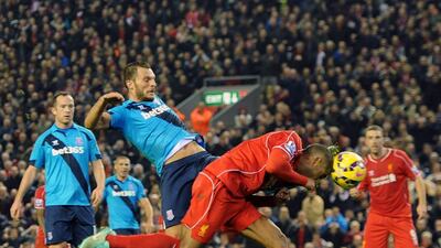 Glen Johnson dives in to score Liverpool's opening goal during their English Premier League match against Stoke City at Anfield on November 29, 2014. Peter Powell / EPA