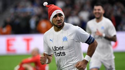 Marseille's French midfielder Dimitri Payet decided to get into the festive spirit by sporting this Santa Claus hat after scoring for Marseille against Nimes in December, 2019. AFP
