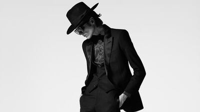 A Bowie-inspired silhouette, with an unmistakable wide-brimmed hat and aviator shades. Courtesy Saint Laurent