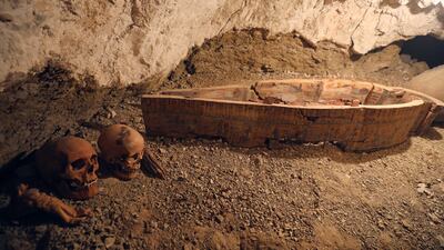 Skulls and hands are seen next to a coffin in the recently discovered tomb of Amenemhat in Egypt. Mohamed Abd El Ghany / Reuters