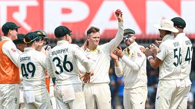 Australia's Matthew Kuhnemann, centre, celebrates after taking his fifth wicket during Day 1 of the third Test against India in Indore on March 1, 2023. AFP