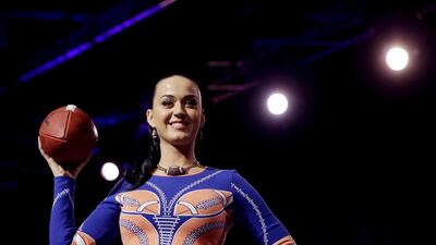 Katy Perry shows off her dress at a news conference about her half-time show for Super Bowl XLIX in Arizona. David J Phillip / AP