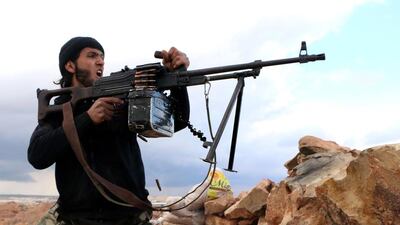 A rebel fighter fires towards pro-regime forces during clashes in Sheikh Najar area of Aleppo. The Assad regime has sought to pit rebel groups against each other, in order to emerge victorious. (AFP Photo/Aleppo Media Centre/Fadi Al Halabi.)