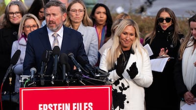 Representatives Marjorie Taylor Greene, right, and Thomas Massie appear at a news conference about the Epstein Files Transparency Act. AP