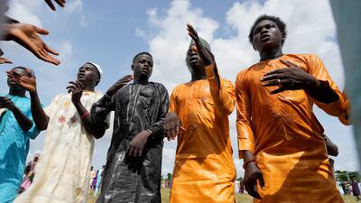 Muslims celebrate after Eid Al Fitr prayers in Lagos, Nigeria. AP