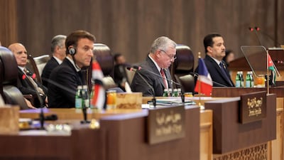 Jordan's King Abdullah II addresses delegates as he is flanked by French President Emmanuel Macron, left, and Iraqi Prime Minister Mohammed Shia Al Sudani during the Baghdad Conference for Co-operation and Partnership in Sweimeh, Jordan. AFP