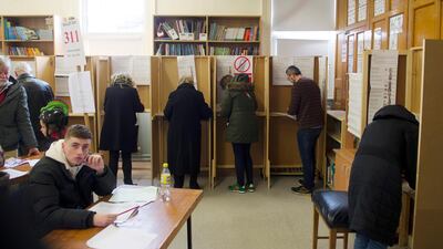 Irish people vote in general elections at a polling station in Dublin, Ireland. EPA