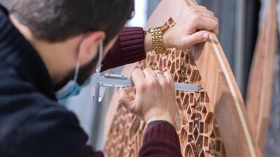 Minjara's Ali Boksmati carves patterns for the moucharabiya on Minjara's CNC machine, the only one in Tripoli. Photo: Ahmad Zaatiti