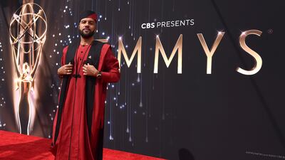 O-T Fagbenle in a traditional Nigerian look in red with black accents by a Lagos brand, Sofisticat. AP