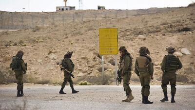 Israeli soldiers patrol the area near the Israeli-Egyptian border after coming under fire from extremists based in Sinai. In El Arish, around 30 Egyptian soldiers were killed in a suicide bombing. Photo: Amir Cohen / Reuters