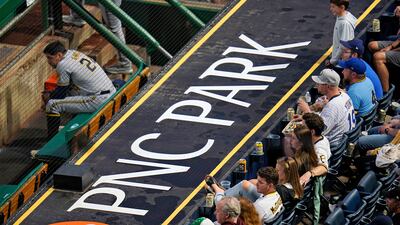 Milwaukee Brewers' Avisail Garcia sits in the dugout as fans watch a baseball game between the Pittsburgh Pirates and the Milwaukee Brewers at PNC Park in Pittsburgh, US. Last month, the Pirates offered free tickets to fans who got a Covid-19 vaccine at a pre-game clinic. Milwaukee won 7-2.
