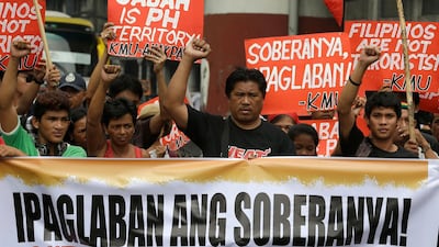 Protesters attend a rally near the Presidential Palace in Manila, Philippines in 2013. Seven years ago, hundreds of militants landed in Sabah, leading to deadly clashes with Malaysian security personnel. AP Photo