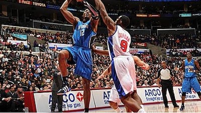 Orlando's Dwight Howard, No 12, shoots over DeAndre Jordan of the Clippers.