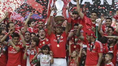 Benfica's players celebrate their team's victory in the Portuguese Primeira Liga to secure the league title on Sunday. Antonio Cotrim / EPA / May 15, 2016