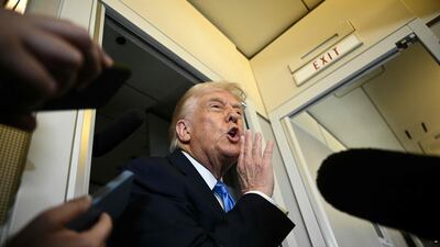 US President Donald Trump speaks to the press aboard Air Force One before arriving at Palm Beach International Airport in West Palm Beach, Florida. AFP