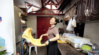 Student cleans the kitchen of the school. Sasamon Rattanalangkarn for The National